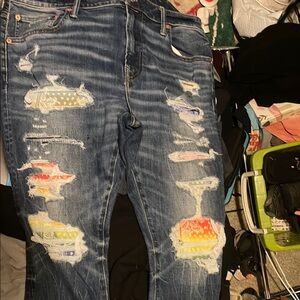 Distressed Blue Jeans with Colorful Patches